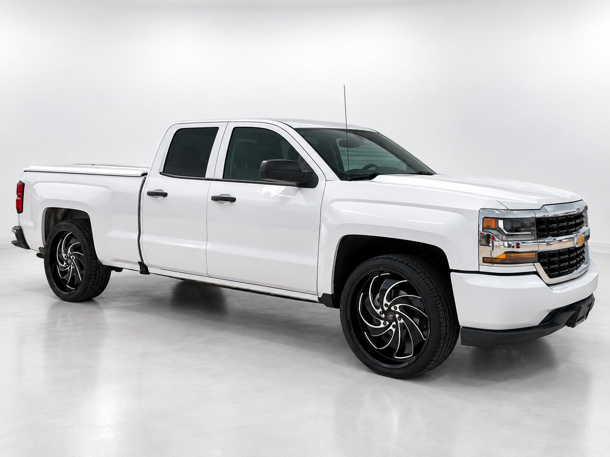 White Chevrolet Silverado with professionally edited studio background