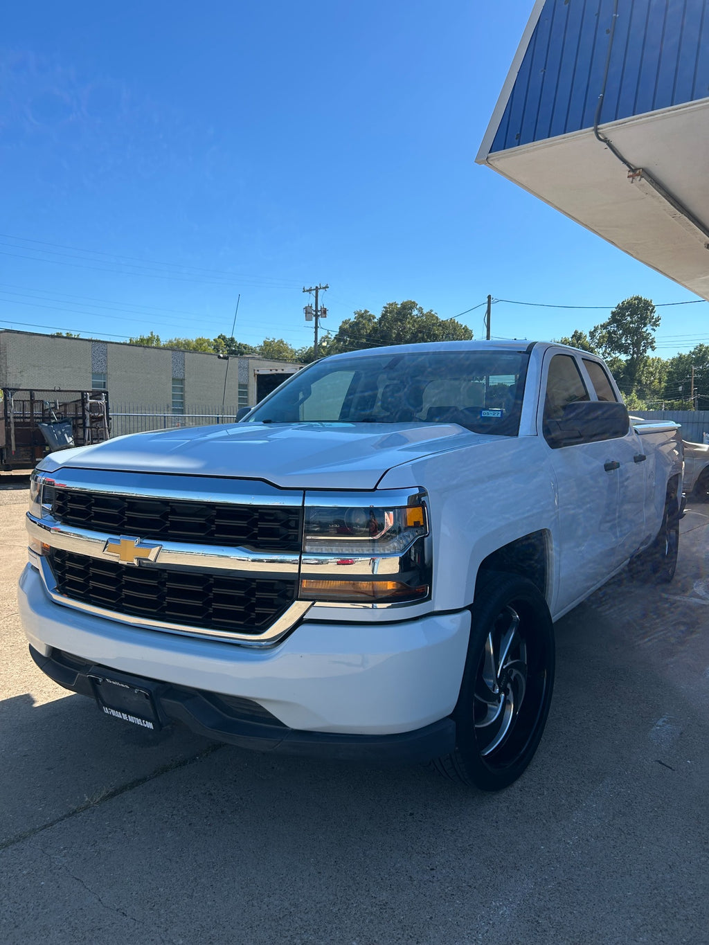 White Chevrolet Silverado front driver-side view