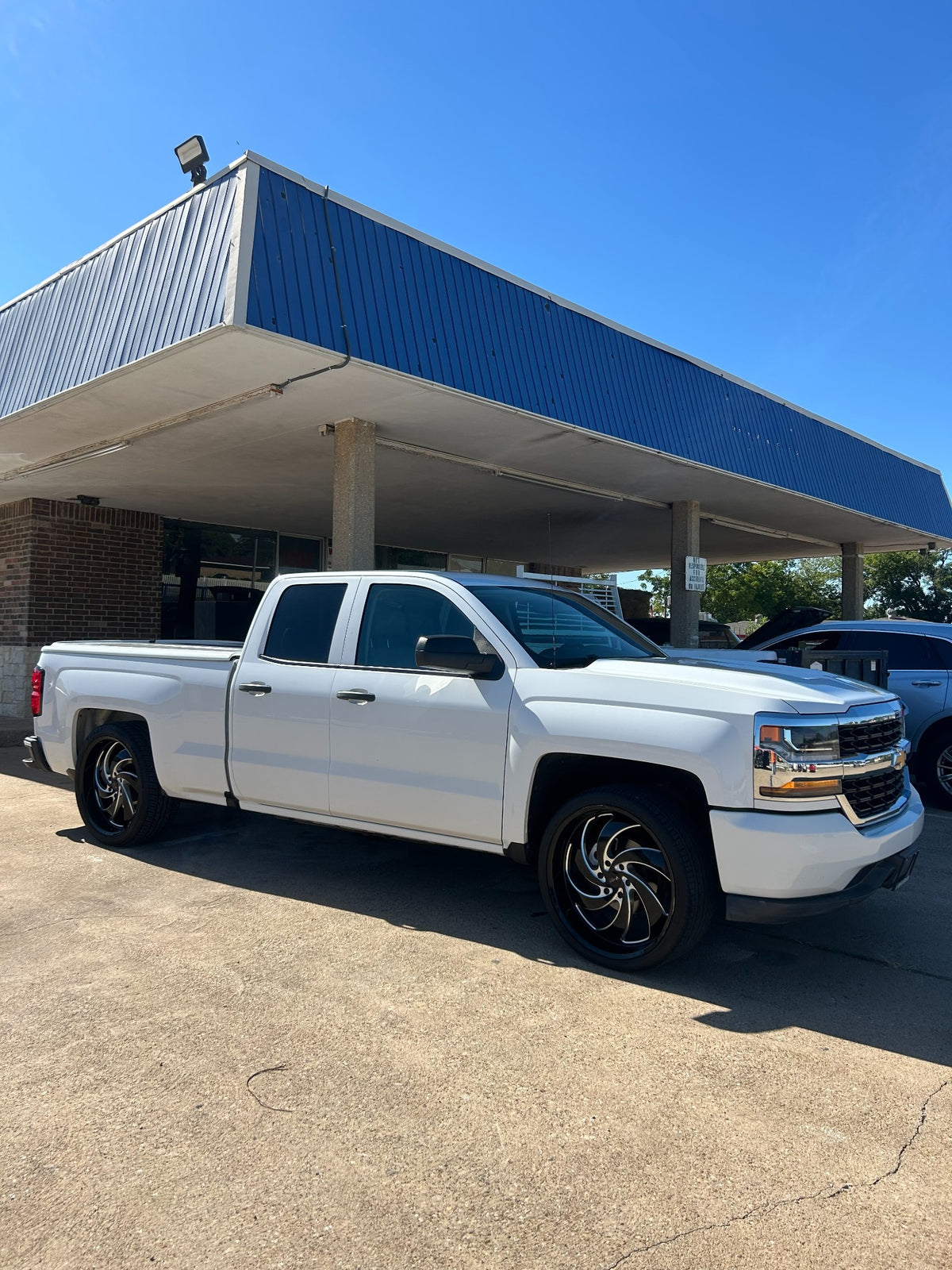 White Chevrolet Silverado passenger-side view
